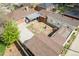 Aerial view showcasing the home's backyard, patio, fire pit, and adjacent neighboring properties at 3021 Grape St, Denver, CO 80207