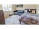 Cozy bedroom featuring a sofa, queen bed and patterned floor at 3021 Grape St, Denver, CO 80207