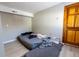 Unfurnished bedroom featuring a wooden door at 3021 Grape St, Denver, CO 80207