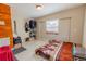 Bright bedroom featuring closet and a window at 3021 Grape St, Denver, CO 80207