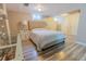 Comfortable bedroom featuring a vanity, and wood-look laminate flooring at 3021 Grape St, Denver, CO 80207