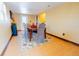 Sunlit dining room featuring a wood table with seating for six at 3021 Grape St, Denver, CO 80207