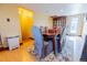 Open concept dining area featuring a decorative rug, a wooden table and plush seating at 3021 Grape St, Denver, CO 80207
