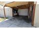 Large, unfinished garage with storage space and an open doorway for easy access and potential projects at 3021 Grape St, Denver, CO 80207
