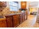 Kitchen featuring a wood countertop, backsplash, and stainless steel sink at 3021 Grape St, Denver, CO 80207