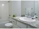 Bathroom featuring a shower and vanity with granite countertops at 11860 Sandcastle Ct, Parker, CO 80138