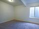 Bedroom with neutral carpet, white trim and walls, and one egress window at 11860 Sandcastle Ct, Parker, CO 80138