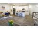Modern kitchen with granite island, stainless steel appliances, and white cabinets at 11860 Sandcastle Ct, Parker, CO 80138