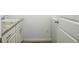 This laundry room features granite countertops, white cabinets, and a sink at 11860 Sandcastle Ct, Parker, CO 80138