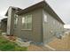 View of the home's side exterior and low maintenance landscaping at 11860 Sandcastle Ct, Parker, CO 80138