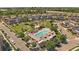 Overhead view of the neighborhood pool, playground, and adjacent park featuring lush green spaces at 5663 W 96Th Ave, Westminster, CO 80020