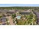 Aerial view of community featuring a pool, clubhouse, playground, and manicured landscaping at 5663 W 96Th Ave, Westminster, CO 80020