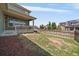 Large backyard features a wooden fence and covered patio space, perfect for entertaining at 5663 W 96Th Ave, Westminster, CO 80020