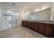 Bathroom featuring a large vanity and walk-in shower with glass door at 5663 W 96Th Ave, Westminster, CO 80020