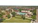 Aerial view showcasing a beautiful community pool, playground, and surrounding manicured landscaping at 5663 W 96Th Ave, Westminster, CO 80020