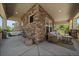 Spacious covered front porch with seating, a porch swing, and stylish outdoor decor at 5663 W 96Th Ave, Westminster, CO 80020