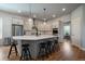 Bright kitchen boasts quartz countertops, stainless steel appliances, and island seating at 5663 W 96Th Ave, Westminster, CO 80020