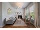 Cozy living room with a fireplace, natural light, and stylish decor at 5663 W 96Th Ave, Westminster, CO 80020