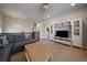 Cozy living area with built-in shelving, soft carpet, and comfortable gray couch at 5663 W 96Th Ave, Westminster, CO 80020