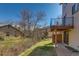 View of the house from the backyard and grassy hill at 1013 Homestake Dr # 17C, Golden, CO 80401