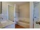 Bathroom featuring vanity with white countertops and a bathtub with a shower at 1013 Homestake Dr # 17C, Golden, CO 80401