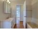 Bathroom featuring a vanity with white countertops and view to bedroom beyond at 1013 Homestake Dr # 17C, Golden, CO 80401