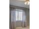 Bedroom features a large window and neutral-toned walls with sheer curtains at 1013 Homestake Dr # 17C, Golden, CO 80401