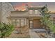 Charming townhome featuring brick accents, mature landscaping, and a serene sunset backdrop at 1013 Homestake Dr # 17C, Golden, CO 80401