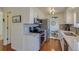 Well-lit kitchen with stainless steel appliances, granite countertops, and views of the dining room at 1013 Homestake Dr # 17C, Golden, CO 80401