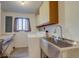 Functional laundry area with utility sink and modern appliances at 1013 Homestake Dr # 17C, Golden, CO 80401