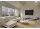 Bright living room featuring vaulted ceilings, large windows, and modern furnishings at 1013 Homestake Dr # 17C, Golden, CO 80401