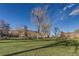 Open green park with trees and buildings in the background on a sunny day in Golden, Colorado at 1013 Homestake Dr # 17C, Golden, CO 80401