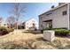 Lovely exterior view of building with shared yard space and private patio at 3600 S Pierce St # 106, Lakewood, CO 80235