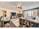 Cozy living room with a stone fireplace and ceiling fan at 3600 S Pierce St # 106, Lakewood, CO 80235