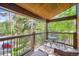 Relaxing balcony space with furniture and scenic views of lush greenery and distant buildings at 180 Broken Lance Dr # 14, Breckenridge, CO 80424