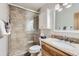 Bathroom with a walk-in shower, modern fixtures, and updated vanity at 180 Broken Lance Dr # 14, Breckenridge, CO 80424