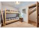 Bedroom with bunkbeds, neutral decor, carpet and an adjacent hallway at 180 Broken Lance Dr # 14, Breckenridge, CO 80424