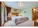 Comfortable bedroom featuring access to the balcony with wooden accents and ski decor at 180 Broken Lance Dr # 14, Breckenridge, CO 80424