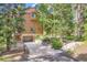 Attractive multi-story home features a garage, stone accents, and a beautifully landscaped yard with mature trees at 180 Broken Lance Dr # 14, Breckenridge, CO 80424