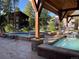Enjoy community hot tubs on a sunny day with well maintained landscaping and mountain views at 180 Broken Lance Dr # 14, Breckenridge, CO 80424