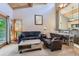 Comfortable living room with vaulted ceilings, exposed beams, and a view of the adjacent dining area and kitchen at 180 Broken Lance Dr # 14, Breckenridge, CO 80424