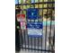Community pool gate with rules and information displayed on signs, ensures a safe and informed environment at 180 Broken Lance Dr # 14, Breckenridge, CO 80424