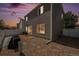 Backyard featuring stone landscaping, a brick patio, and vinyl privacy fence at 4076 Andes Way, Denver, CO 80249
