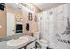Bathroom featuring a vanity with granite counters, framed mirror, and paris themed shower curtain at 4076 Andes Way, Denver, CO 80249