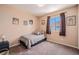 Cozy bedroom featuring carpeted floors, neutral walls, and a sunny window at 4076 Andes Way, Denver, CO 80249