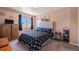 Comfortable bedroom featuring plush carpeting and a modern bed frame at 4076 Andes Way, Denver, CO 80249