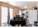 Cozy dining area adjacent to the kitchen with an outside patio at 4076 Andes Way, Denver, CO 80249