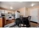 Cozy dining area adjacent to the kitchen with an outside patio at 4076 Andes Way, Denver, CO 80249