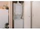 Convenient in-unit laundry closet with stacked washer and dryer at 4076 Andes Way, Denver, CO 80249