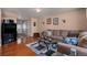 Cozy living room with hardwood floors and comfortable seating at 4076 Andes Way, Denver, CO 80249